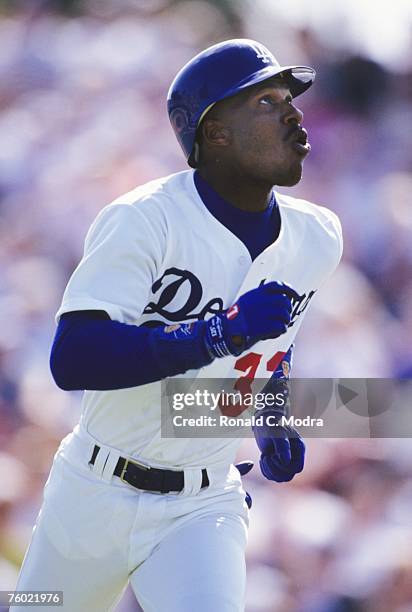 Eric Davis of the Los Angeles Dodgers running to first base during a spring training game against the New York Mets during spring training on March...