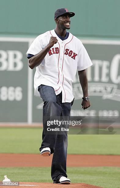 New Boston Celtic Kevin Garnett throws out the first pitch of the game as the Boston Red Sox take on the Baltimore Orioles on August 1, 2007 at...