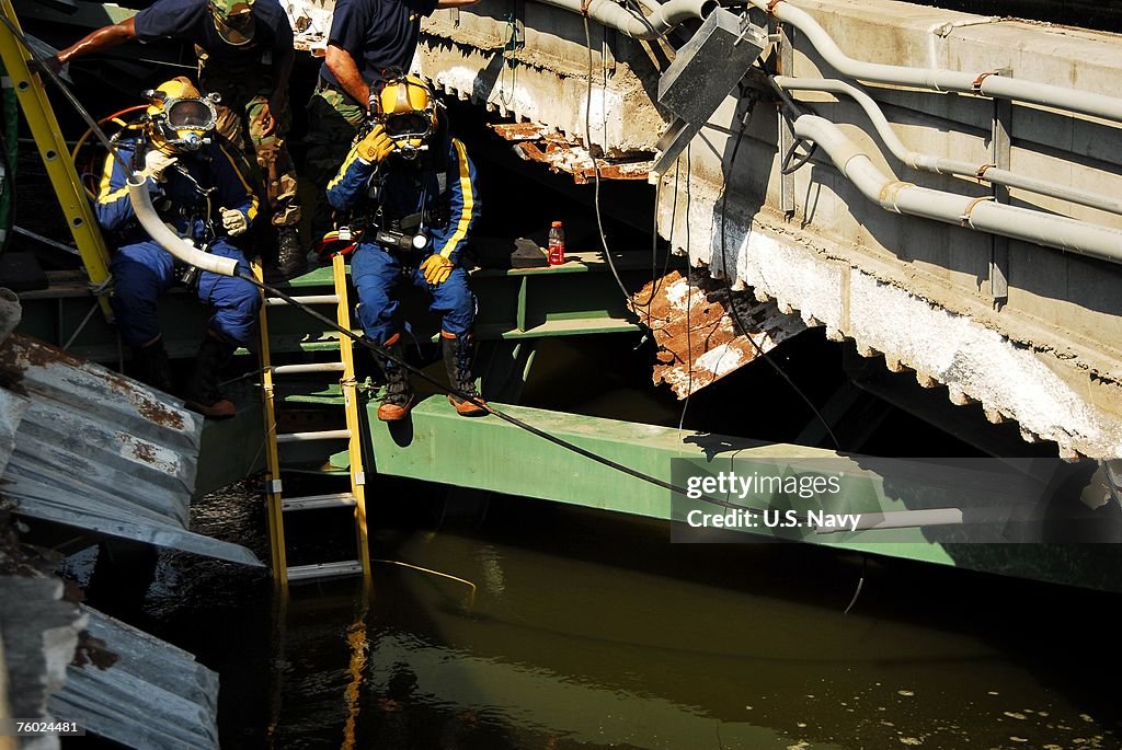 Navy Divers Investigate Site Of Bridge Collapse
