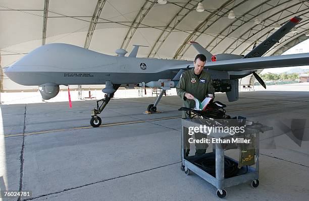 Air Force Maj. Casey Tidgewell prepares an MQ-9 Reaper for a training flight August 8, 2007 at Creech Air Force Base in Indian Springs, Nevada. The...