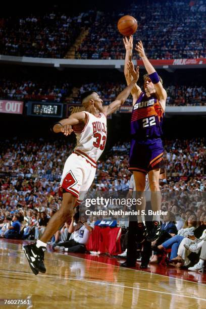 Danny Ainge of the Phoenix Suns attempts a shot against Scottie Pippen of the Chicago Bulls in Game Three of the 1993 NBA Finals on June 13, 1993 at...