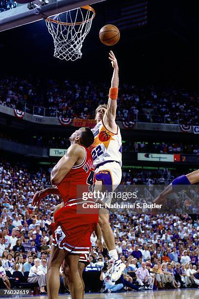 Danny Ainge of the Phoenix Suns shoots a layup against Scott Williams of the Chicago Bulls in Game Two of the 1993 NBA Finals on June 11, 1993 at the...