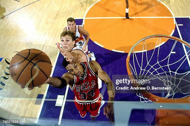 Scottie Pippen of the Chicago Bulls attempts a layup against Danny Ainge of the Phoenix Suns in Game Two of the 1993 NBA Finals on June 11, 1993 at...