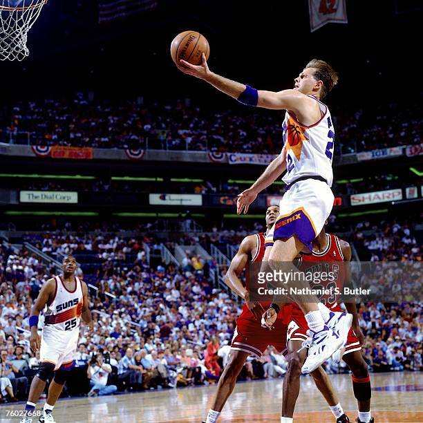 Danny Ainge of the Phoenix Suns attempts a layup against the Chicago Bulls in Game One of the 1993 NBA Finals on June 9, 1993 at the America West...