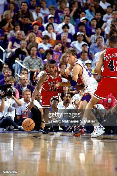 Armstrong of the Chicago Bulls dribbles upcourt against Danny Ainge of the Phoenix Suns in Game One of the 1993 NBA Finals on June 9, 1993 at the...