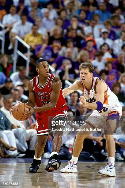 Armstrong of the Chicago Bulls looks to throw a pass against Danny Ainge of the Phoenix Suns in Game One of the 1993 NBA Finals on June 9, 1993 at...