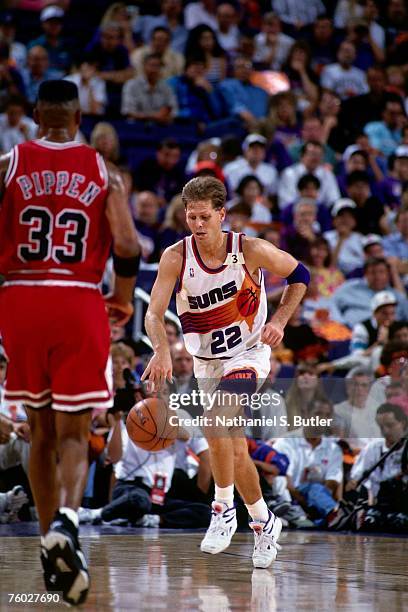 Danny Ainge of the Phoenix Suns dribbles upcourt against Scottie Pippen of the Chicago Bulls in Game One of the 1993 NBA Finals on June 9, 1993 at...