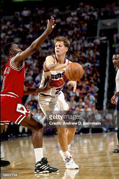 Danny Ainge of the Phoenix Suns throws a pass against the Chicago Bulls in Game One of the 1993 NBA Finals on June 9, 1993 at the America West Arena...