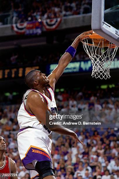 Oliver Miller of the Phoenix Suns dunks against the Chicago Bulls in Game One of the 1993 NBA Finals on June 9, 1993 at the America West Arena in...