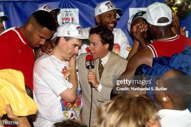 John Paxson of the Chicago Bulls talks with reporter Bob Costas after winning the 1993 NBA Championship after defeating the Phoenix Suns in Game Six...
