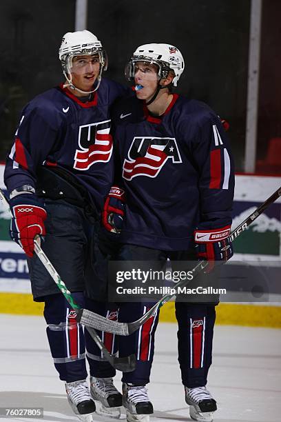 Mike Ratchuk of Team USA Blue congratulates his teammate Patrick Kane on his second goal of the night against Team Sweden during the second period of...