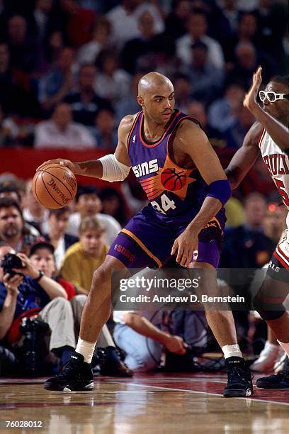 Charles Barkley of the Phoenix Suns posts up against the Chicago Bulls in Game Four of the 1993 NBA Finals on June 16, 1993 at the Chicago Stadium in...