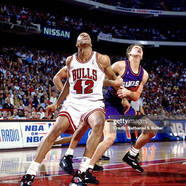 Scott Williams of the Chicago Bulls boxes out against Danny Ainge of the Phoenix Suns in Game Four of the 1993 NBA Finals on June 16, 1993 at the...