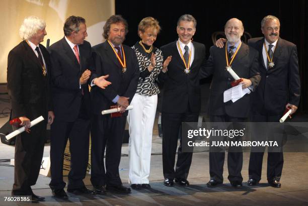 Spanish vice president Maria Teresa Fernandez poses amidst Spanish mmbassador to Argentina Alfredo Estrella and "Les Luthiers" music ensemble members...