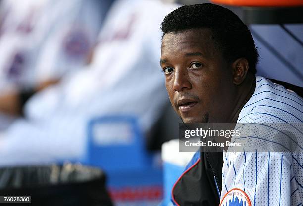 Pitcher Pedro Martinez of the New York Mets rests on the bench in the second inning during a rehab start for the Saint Lucie Mets against the...
