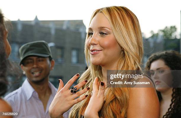 Amanda Bynes talks to guests at the launch party of her new clothing line ''DEAR'' at Sushi Samba on August 8, 2007 in New York City.