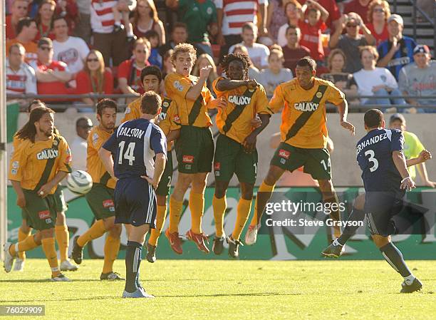 Wall of Los Angeles Galaxy defenders stops a shot by Daniel Hernandez of the New England Revolution during the first-half of the 2005 MLS Cup at...