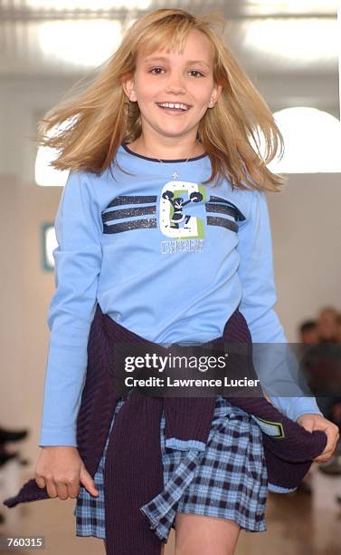 Model Jamie Lynn Spears participates in the Fall 2002 Kids R Us fashion runway show April 11, 2002 in New York City. Spears is wearing a blue long...