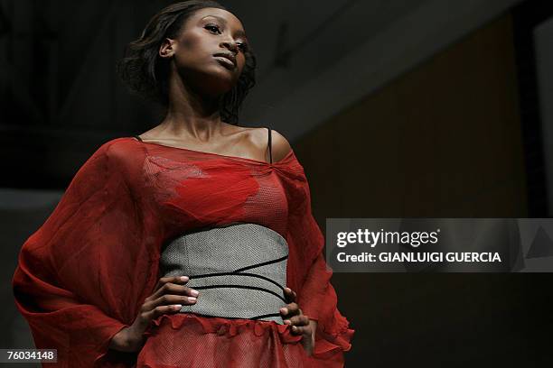 Model shows a creation by Russian designer Julia Dalakian 09 August 2007 on the catwalk during Cape Town fashion week in Cape Town. Now in its fourth...