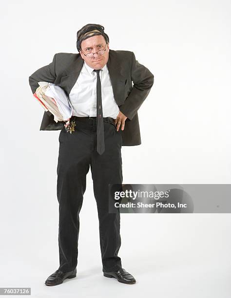 businessman with hands on hips, portrait - abe cross stockfoto's en -beelden