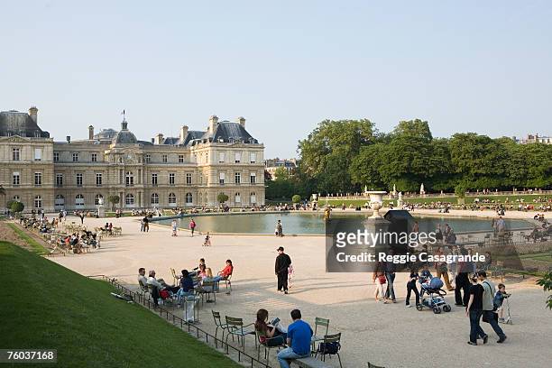 france, paris, people relaxing in garden of luxembourg palace - jardin du luxembourg photos et images de collection