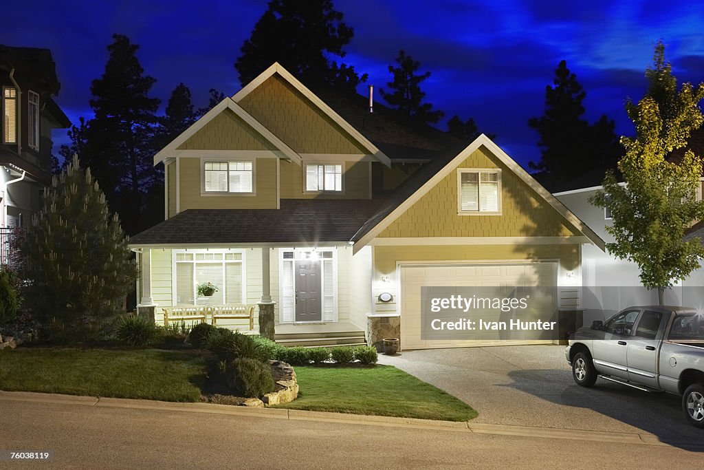 Canada, British Columbia, Kelowna, House exterior and driveway at night