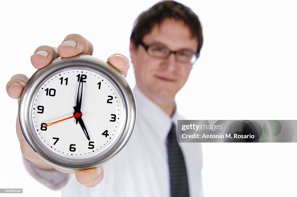 5 Clock Position Businessman Holding Clock With Clock At 5pm Position Focus On ...