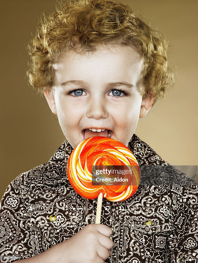 portrait little boy licking lilipop Boy Licking Lollipop Portrait Closeup High-Res Stock Photo - Getty Images