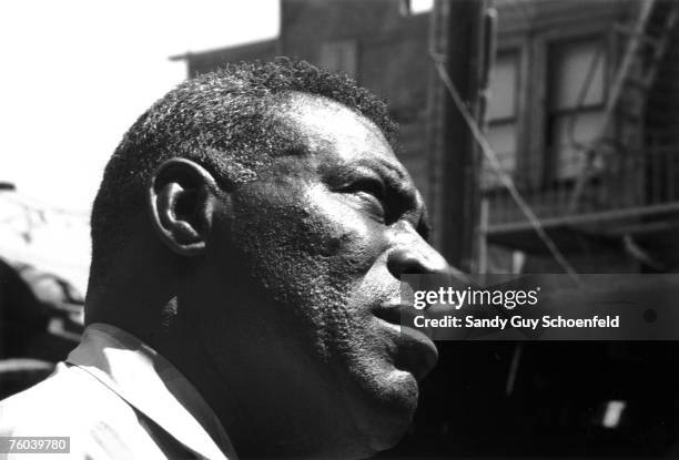 Blues musician Howlin' Wolf poses for a portrait session holding an Epiphone hollowbody electric guitar behind the Fillmore in July 1968 in San...