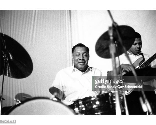 Blues musician Howlin' Wolf's rhythm section including drummer Cassell Burrows and bass player Alvin Nichols aka B.B. Jones perform onstage at the...