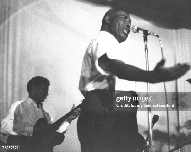 Blues musician Howlin' Wolf performs onstage at the Avalon Ballroom, a music venue in the Polk Gulch neighborhood, with his guitarist Hubert Sumlin...