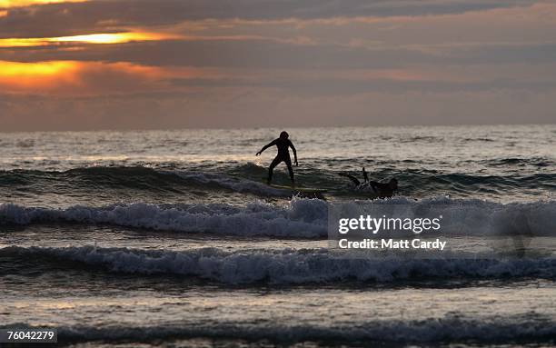 Surfer in the sea at Polzeath near to site of the Ripcurl Boardmasters at Fistral Beach on August 9 2007 in Cornwall, England. The annual festival at...