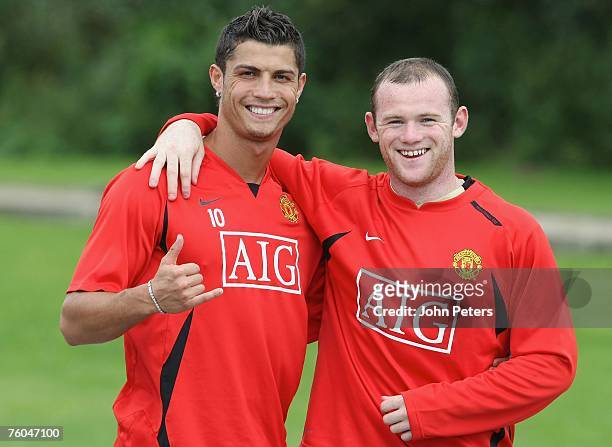Cristiano Ronaldo and Wayne Rooney of Manchester United pose during a First Team Training Session at Carrington Training Ground on August 7 2007 in...