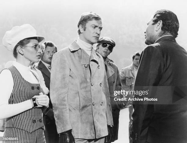 From left to right, Margaret Blye as Lorna, Benny Hill as Professor Peach, Michael Caine as Charlie Croker, Michael Standing as Arthur and Raf...