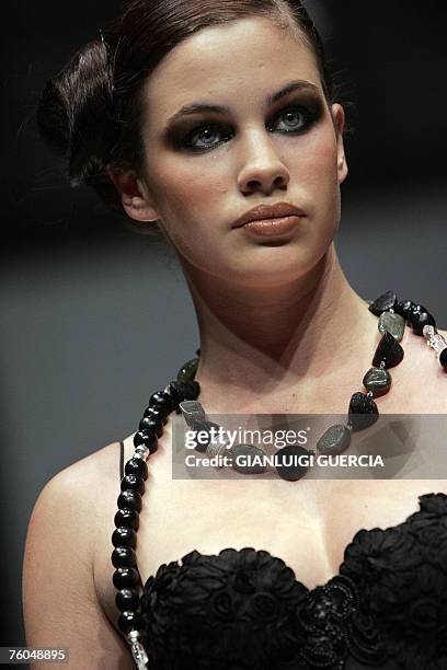 Models shows 10 August 2007 one of the creations of South African designer Kobus Dippenaar during the third day of the Cape Town fashion week in Cape...