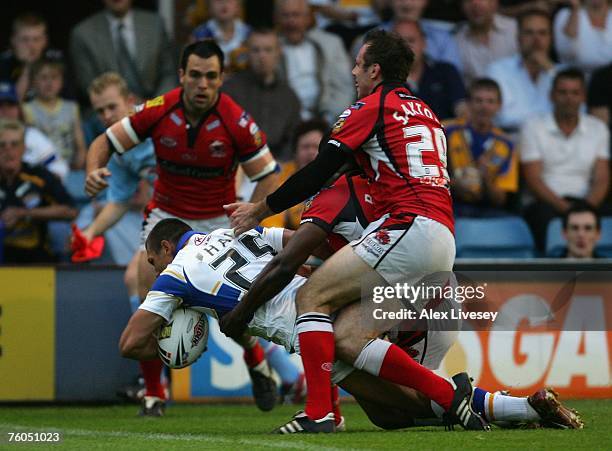 Ryan Hall of Leeds Rhinos dives over the line for the opening try during the Engage Super League match between Leeds Rhinos and Salford Reds at...