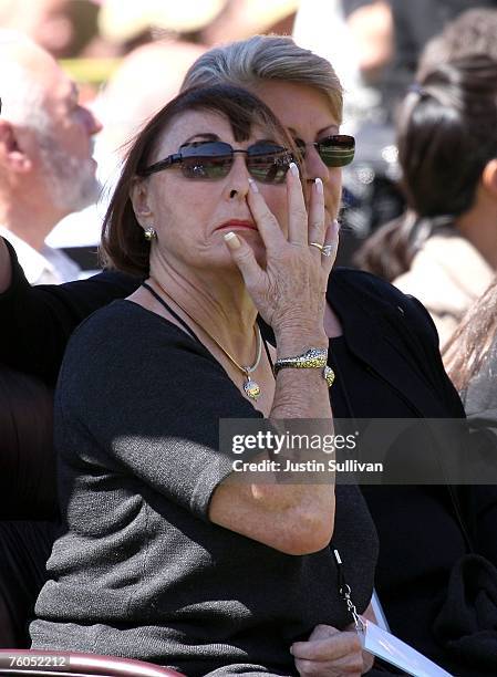 Geri Walsh, widow of former 49ers coach Bill Walsh, wipes her eye during a public memorial service for Walsh August 10, 2007 at Monster Park in San...