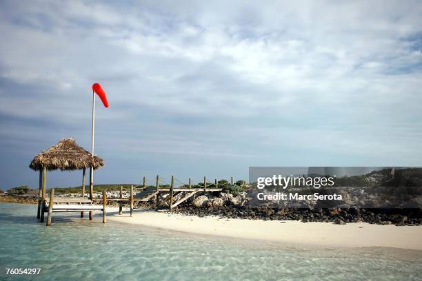 Wind sock and wooden dock marks the spot of the airport on the private island of David Copperfield on February 2007 in Musha Cay, Bahamas....