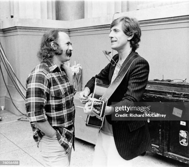 David Crosby and Graham Nash of Crosby, Stills & Nash chat backstage at The Winterland Ballroom in 1978 in San Francisco, California.