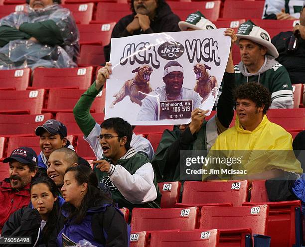 Fans hold up a banner in reference to Atlanta Falcon quarterback Michael Vick as the New York Jets play the Falcons at Giants Stadium August 10, 2007...