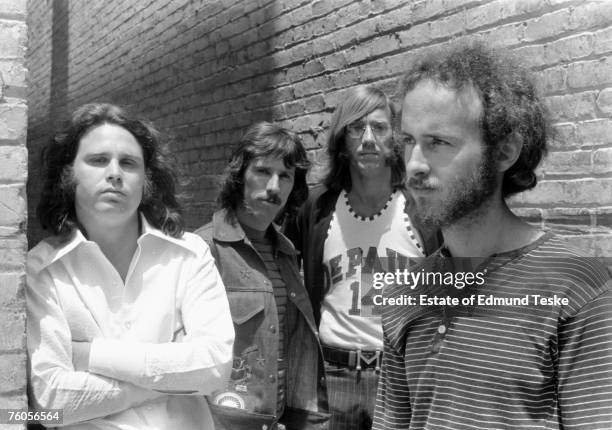 The Doors L-R Jim Morrison, John Densmore, Ray Manzarek and Robby Krieger pose for a portrait circa 1968 in Hollywood, California.