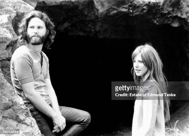 Singer Jim Morrison of The Doors with girlfriend Pamela Courson during a 1969 photo shoot at Bronson Caves in the Hollywood Hills, California.