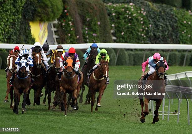 Haddle McDaddle riden by Sebastian Murphy breaks away from the field on the home turn to win the Andrew Clarke and John Collins Handicap during the...