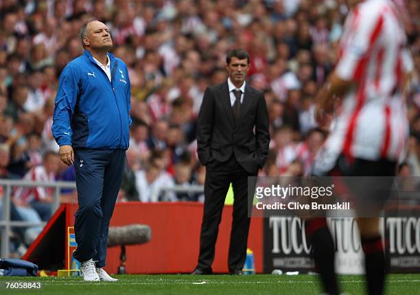 Tottenham Hotspur manager Martin Jol and Sunderland manager Roy Keane watch the Barclays Premier League match between Sunderland and Tottenham...