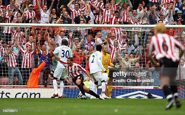 Michael Chopra of Sunderland celebrates his last minute winning goal as Spurs keeper Paul Robinson looks on, during the Barclays Premier League match...