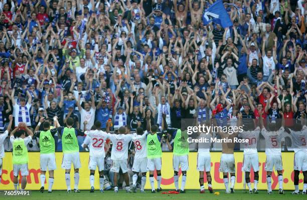 The players of Hamburger SV celebrate with their fans after the Bundesliga match between Hanover 96 and Hamburger SV at the AWD Arena on August 11,...