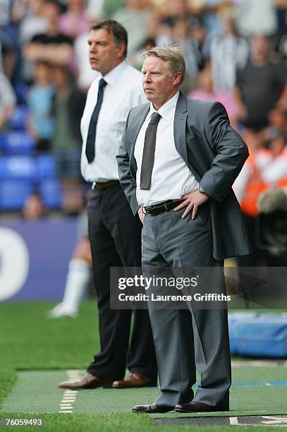 Bolton Wanderers Manager Sammy Lee and Newcastle United Manager Sam Allardyce watch the action from the touchline during the Barclays Premiership...