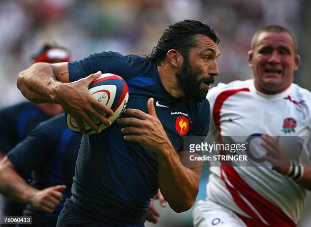 France's Sebastien Chabal powers in to score the winning try ahead of England's Phil Vickery during the Investec Challenge international friendly...