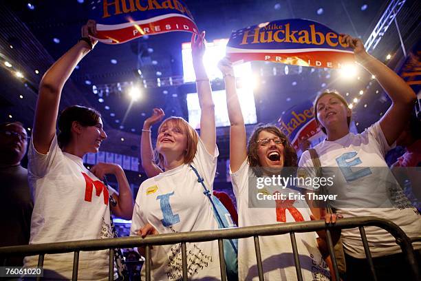 Supporters cheer for Republican presidential candidate Mike Huckabee at the Iowa Straw Poll August 11, 2007 in Ames, Iowa. An estimated 40,000 people...