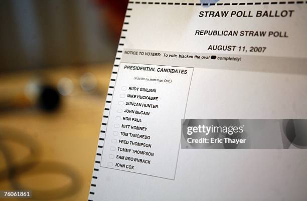 Volunteer holds a ballot in the voting area of the Republican Straw Poll August 11, 2007 in Ames, Iowa. An estimated 40,000 people are expected to...